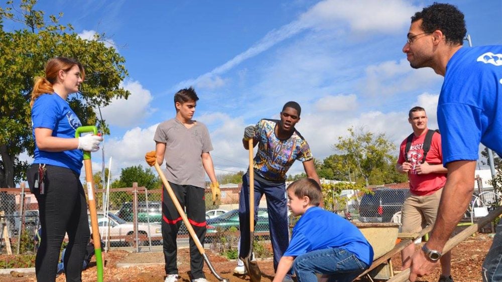 Volunteers at San Diego nonprofit Project New Village at a community garden