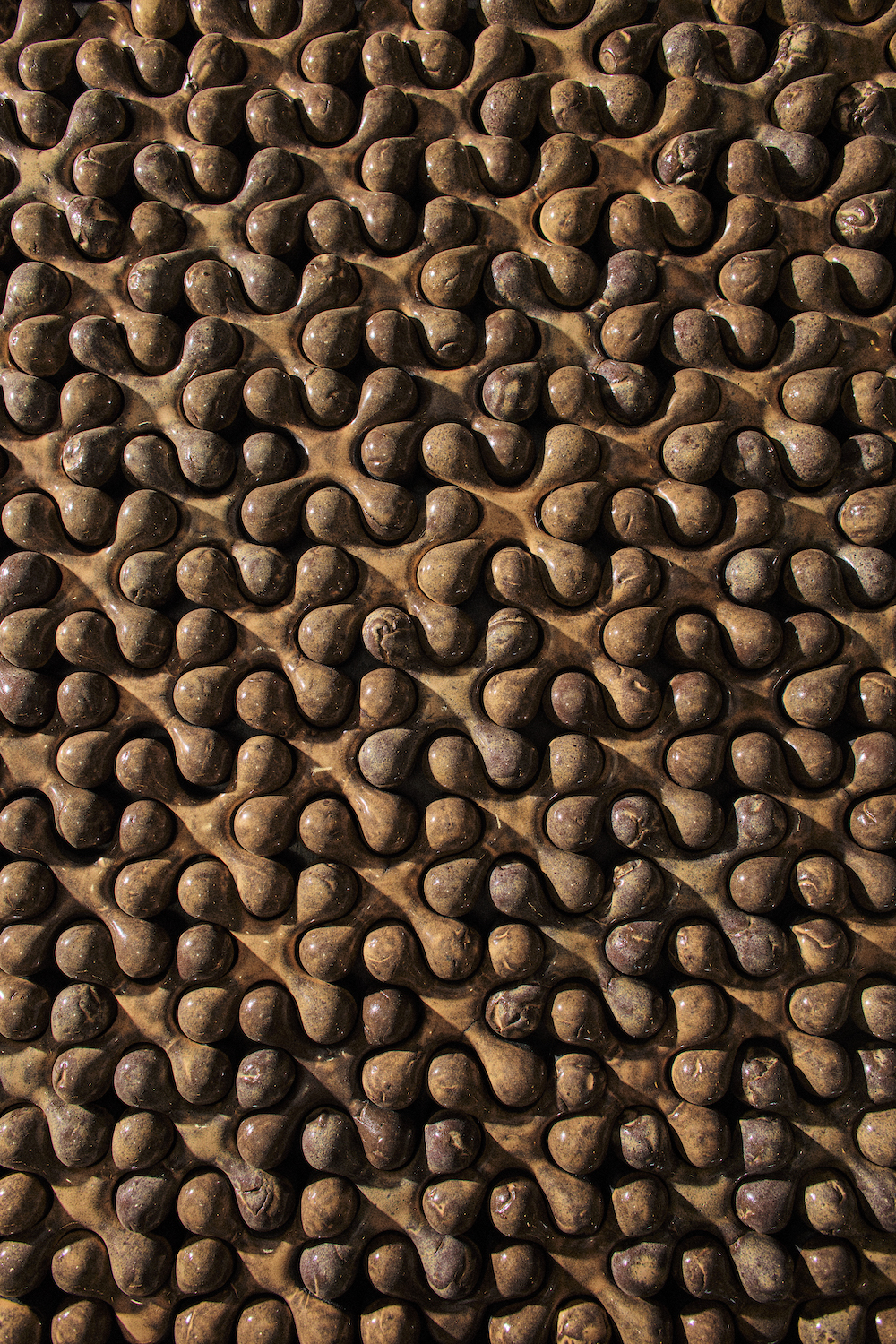 Repeated textures in work from San Diego artists and wood sculptor Dan "Nuge" Nguyen