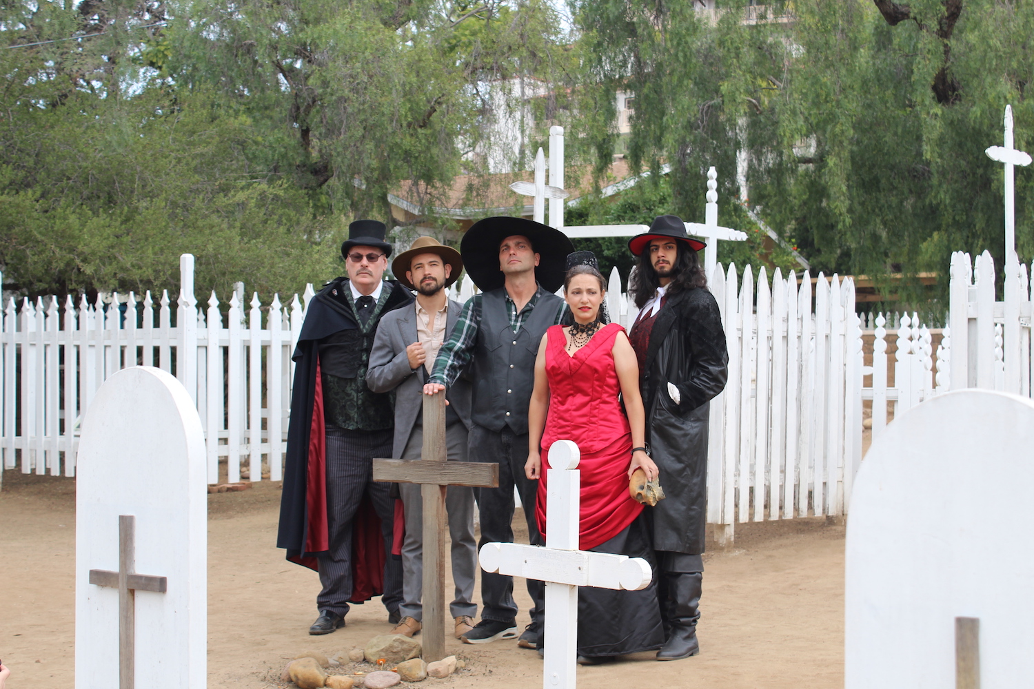 Haunted San Diego Ghost Tours featuring tour guides in costume at a cemetery 