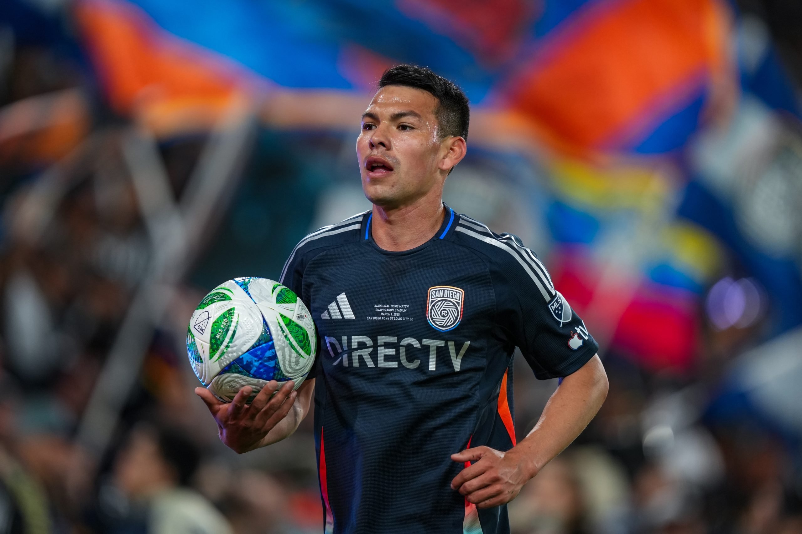 Hirving "Chucky" Lozano carries the game ball during San Diego FC's first-ever home game. 