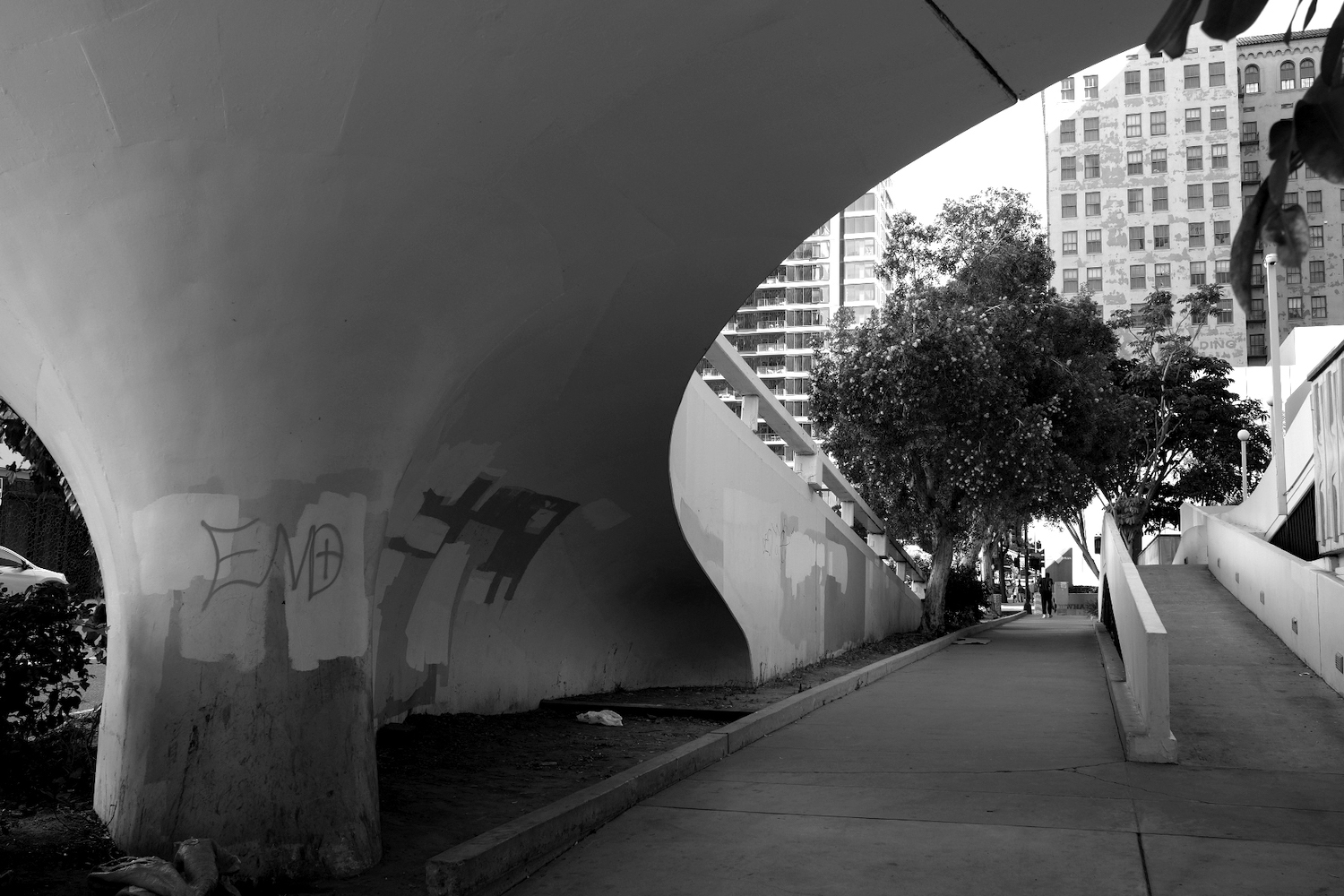 Downtown San Diego featuring overpasses and graffiti near the Civic Center