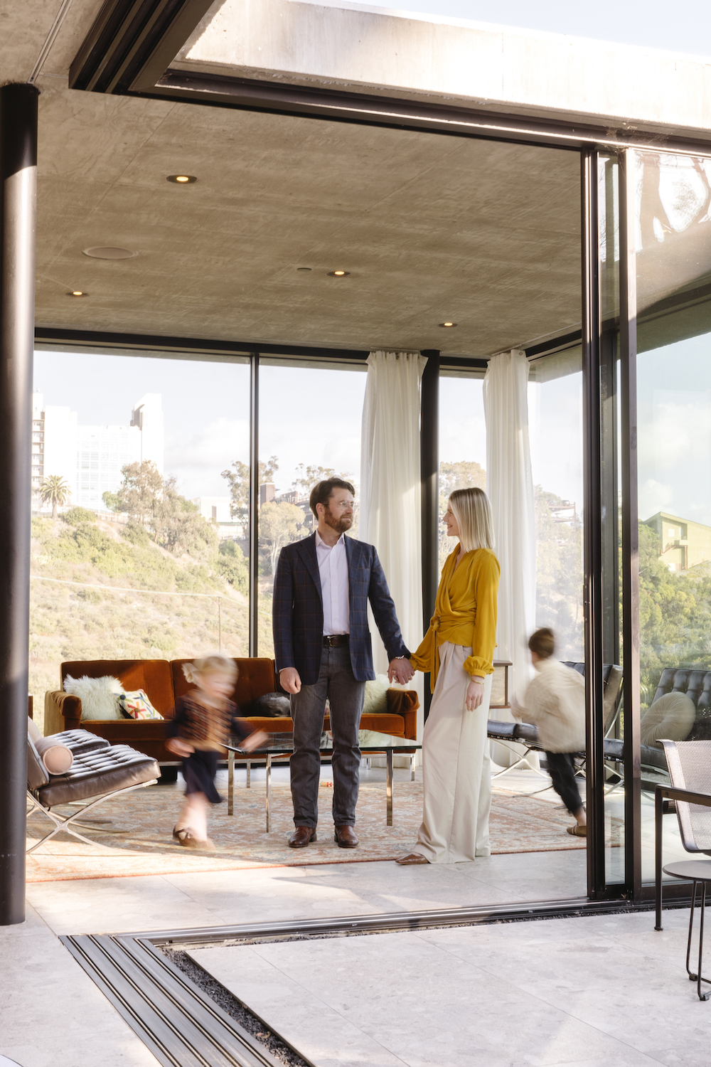 San Diego architect Matthew Segal and his wife April and kids inside their Mission Hills home