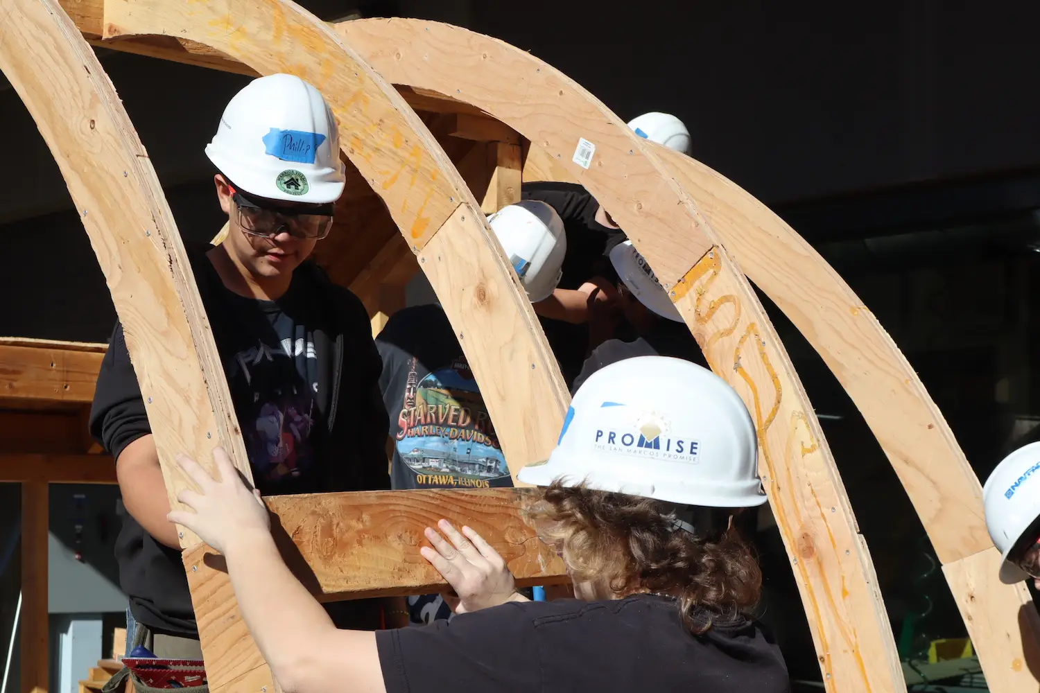High school students from San Marcos High School working with the Warrior Village Project to build homes for homeless veterans in San Diego