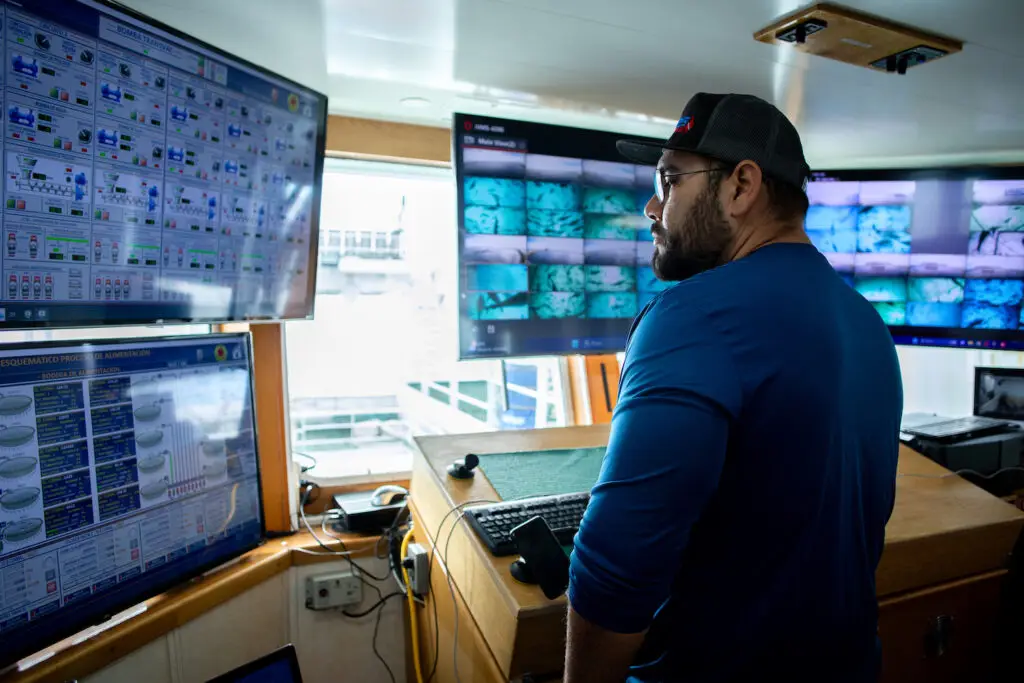 A Baja Aqua Farm worker monitoring the pacifc bluefin tuna feeding process on their offshore operations