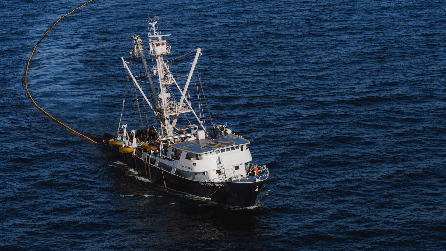 Fishing vessel working on the  Baja Aqua Farms off of Ensenada
