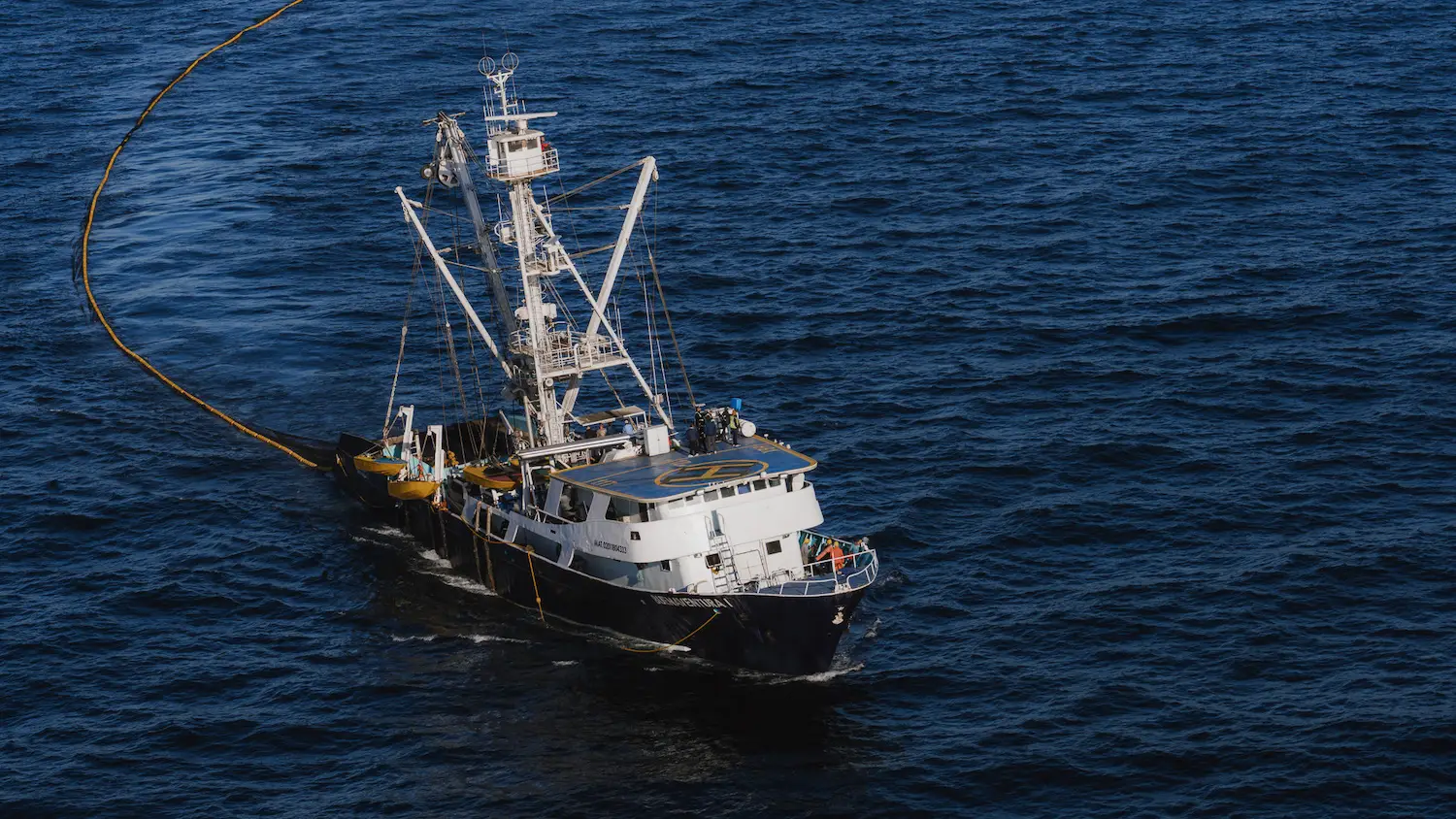 Fishing vessel working on the  Baja Aqua Farms off of Ensenada