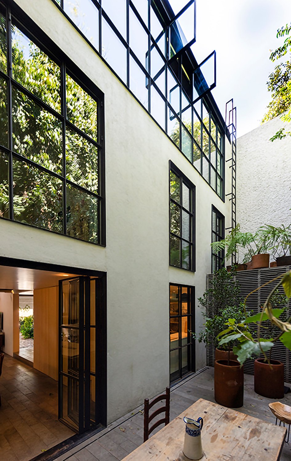 Exterior windows in Mexico City modern home in San Ángel owned by Rosa Agraz and Alejandro Solís