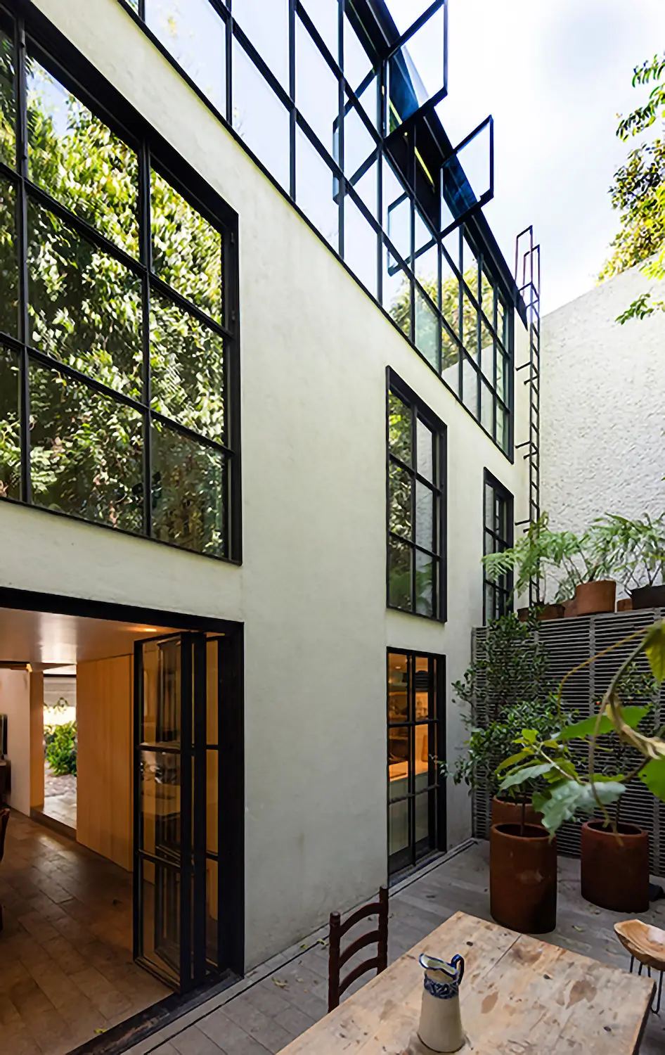 Exterior windows in Mexico City modern home in San Ángel owned by Rosa Agraz and Alejandro Solís