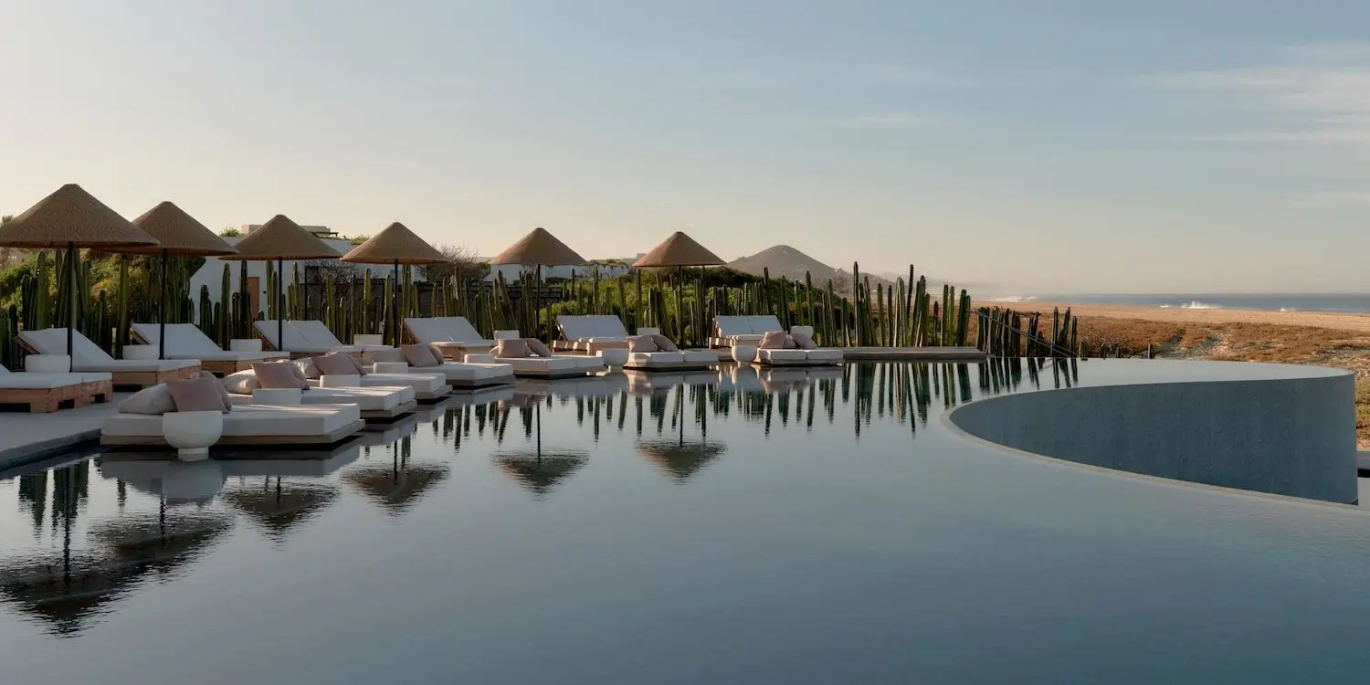 Outdoor pool and lounge area at the Kimpton Mas Olas Botánica Spa in Todos Santos, Mexico