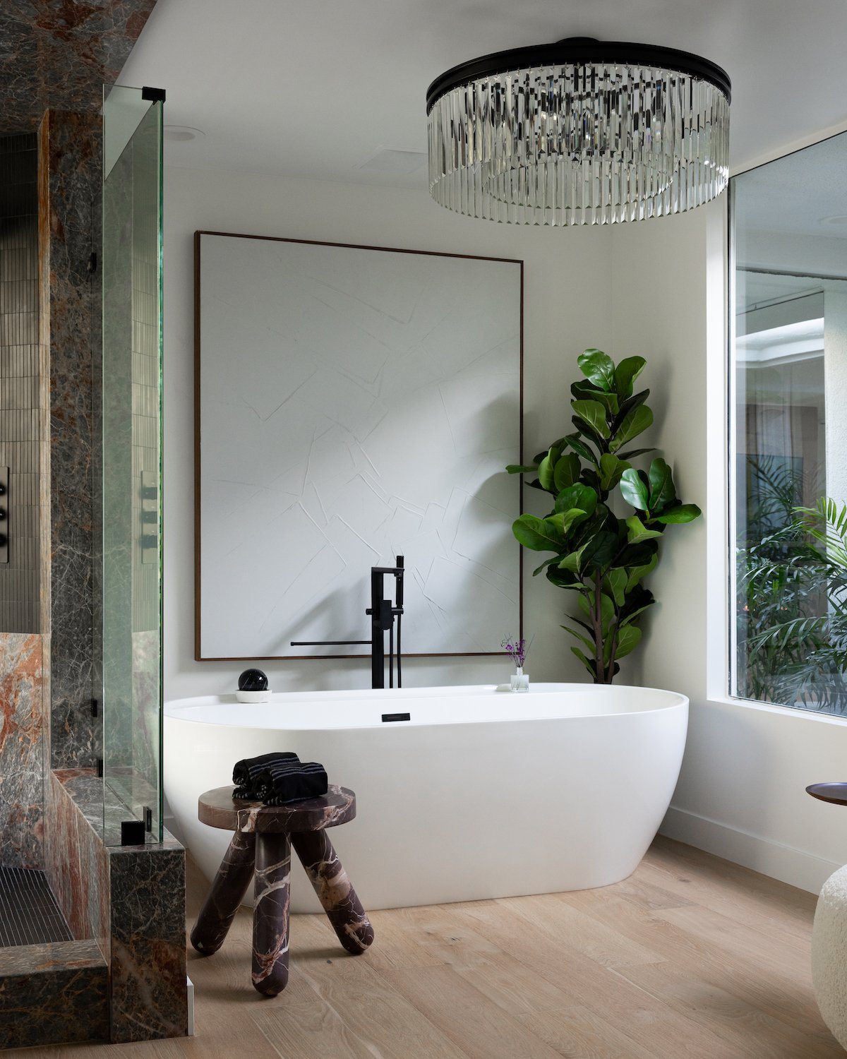 Bathtub and marble shower at HGTV's Hot Properties star Andrew White's San Diego home featuring redesigned by Andrew Gerhard