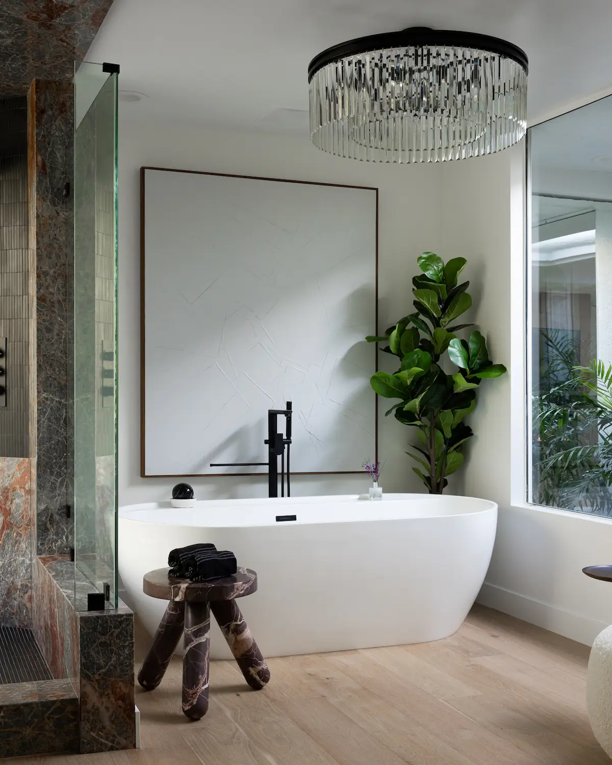 Bathtub and marble shower at HGTV's Hot Properties star Andrew White's San Diego home featuring redesigned by Andrew Gerhard