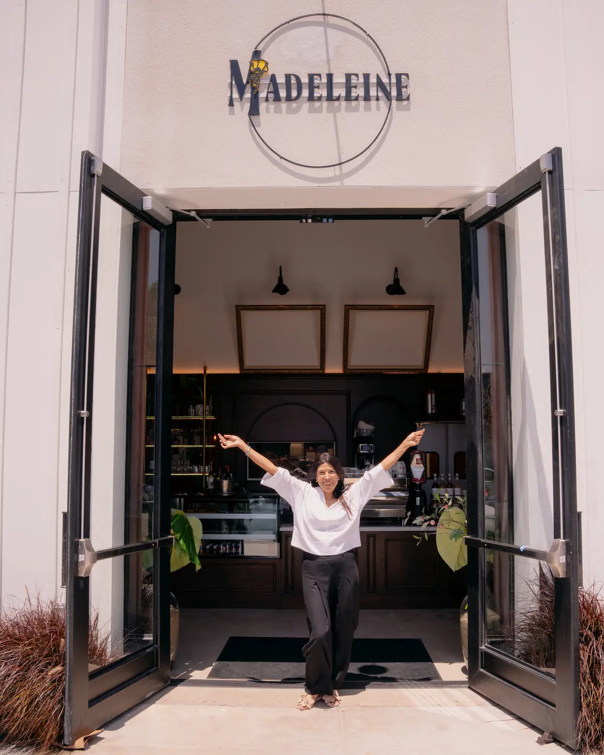 Founder of San Diego's Café Madeleine, Christine Perez, infront of the new Barrio Logan location opened in 2025