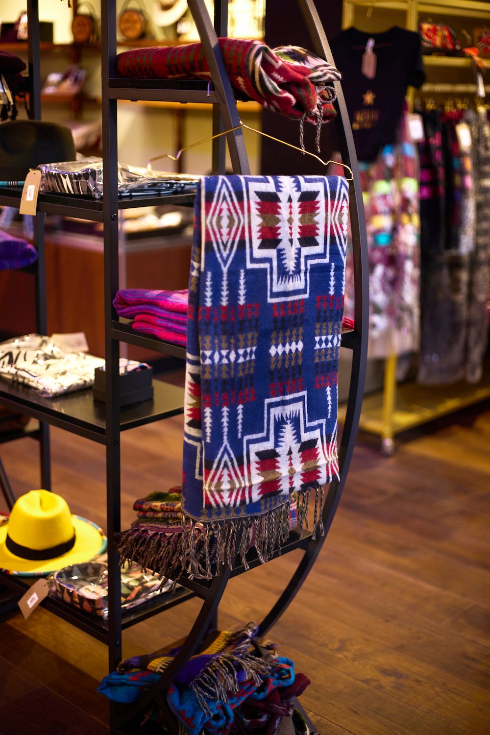 A quilt and clothing attire from San Diego Gaslamp Quarter boutique shop Native Star featuring only Indigenous-made products