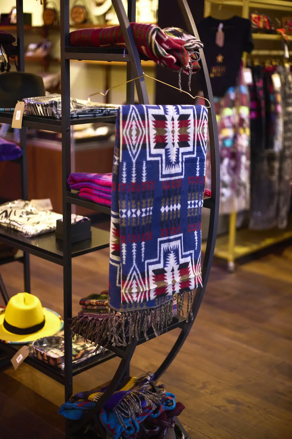 A quilt and clothing attire from San Diego Gaslamp Quarter boutique shop Native Star featuring only Indigenous-made products