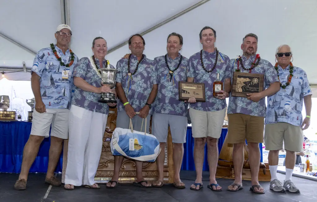 Alli Bell and her crew holding the 2025 Transpacific Yacht Race trophy