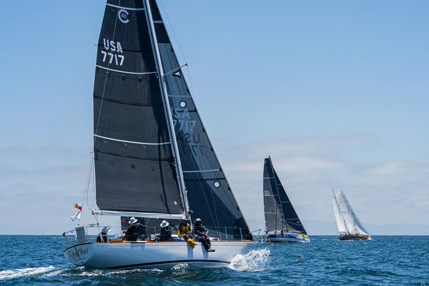 Alli Bell and her crew on the vintage Cal 40 boat called Restless which won the 2025 Transpacific Yacht Race from Los Angeles to Hawaii