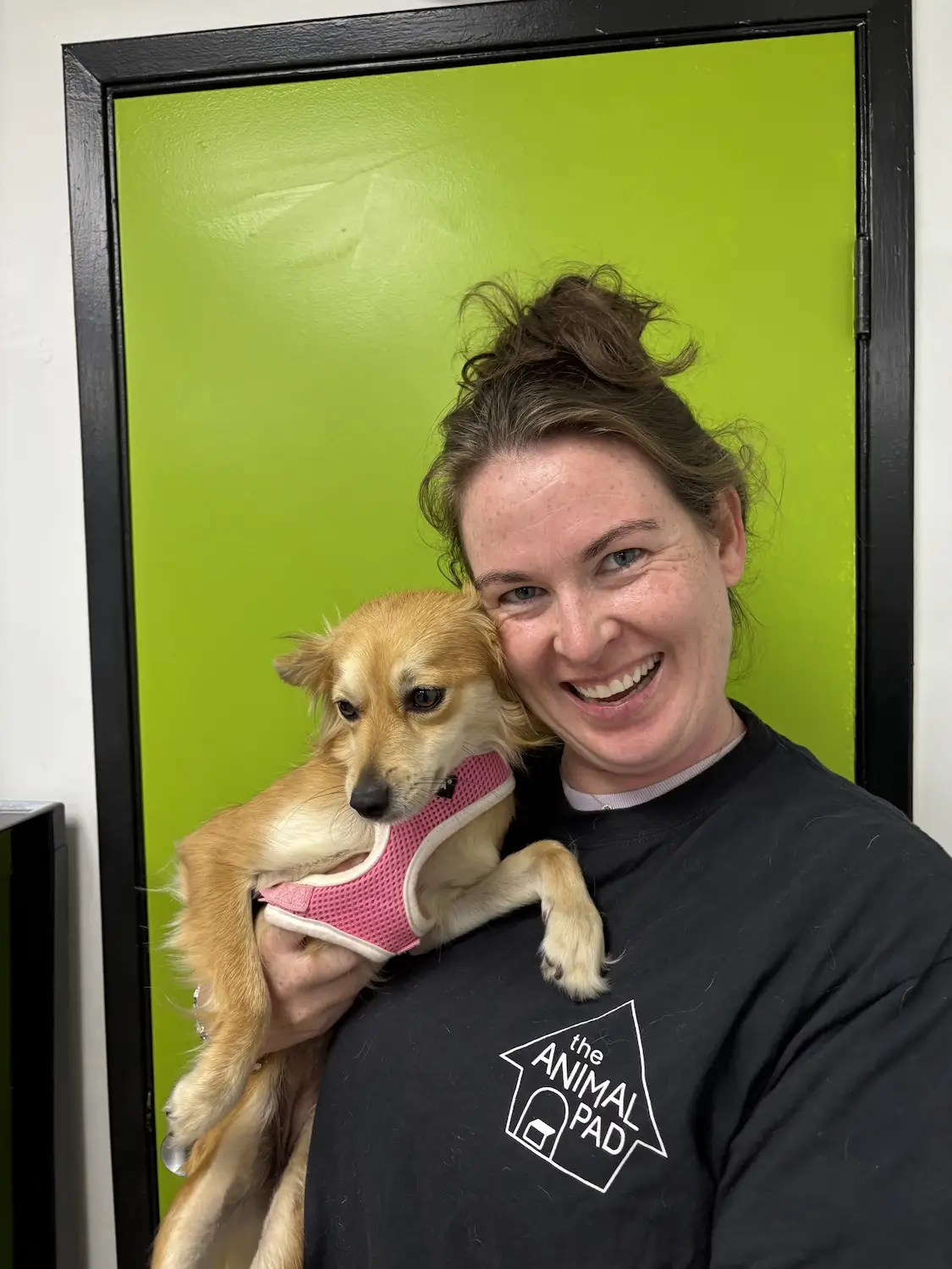 San Diego nonprofit The Animal Pad featuring volunteer Sam Clancy holding her adopted dog