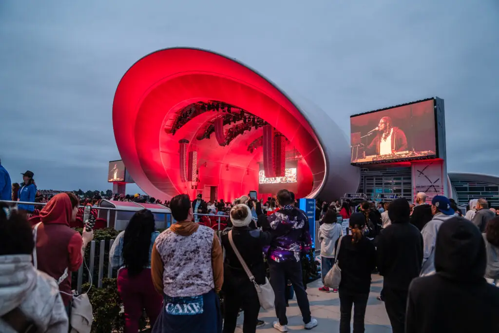 Fans a the Rady Shell at Jacobs Park watching a Ludacris concert from outside the gates for free
