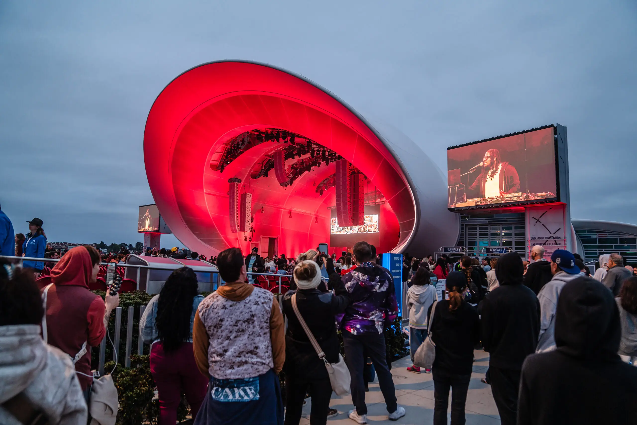 Fans a the Rady Shell at Jacobs Park watching a Ludacris concert from outside the gates for free