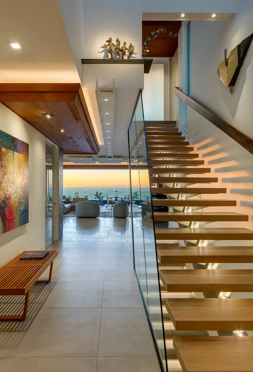 Interior of San Diego architect Dean Meredith's Del Mar home featuring a ceiling light rail staircase