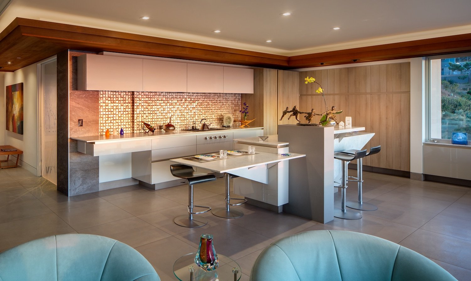 Interior of San Diego architect Dean Meredith's Del Mar home featuring a spacious kitchen with bronze sculptures
