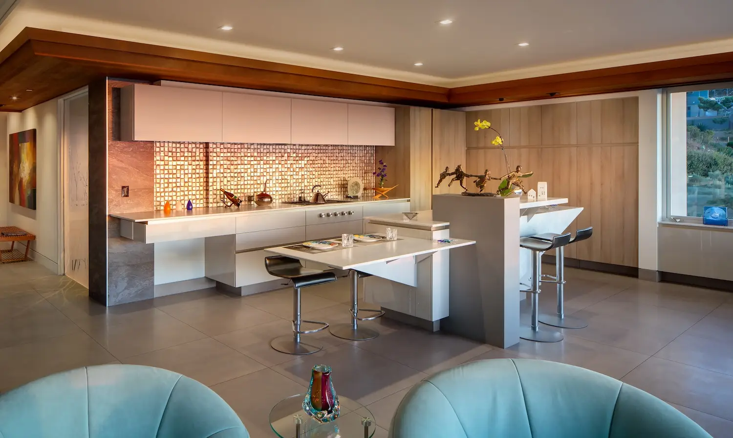 Interior of San Diego architect Dean Meredith's Del Mar home featuring a spacious kitchen with bronze sculptures