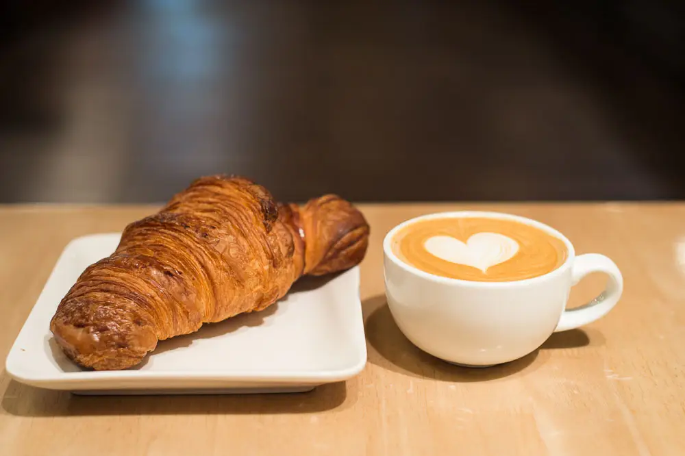 Coffee and croissant from new San Diego coffee shop Tierra Mia Coffee opening in Oceanside