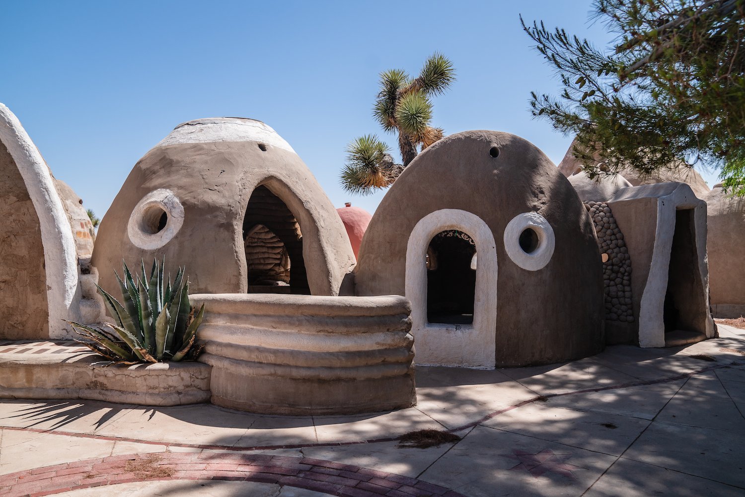 Exterior of CalEarth SuperAdobe fire-resistant home structures based on indigenous homes 