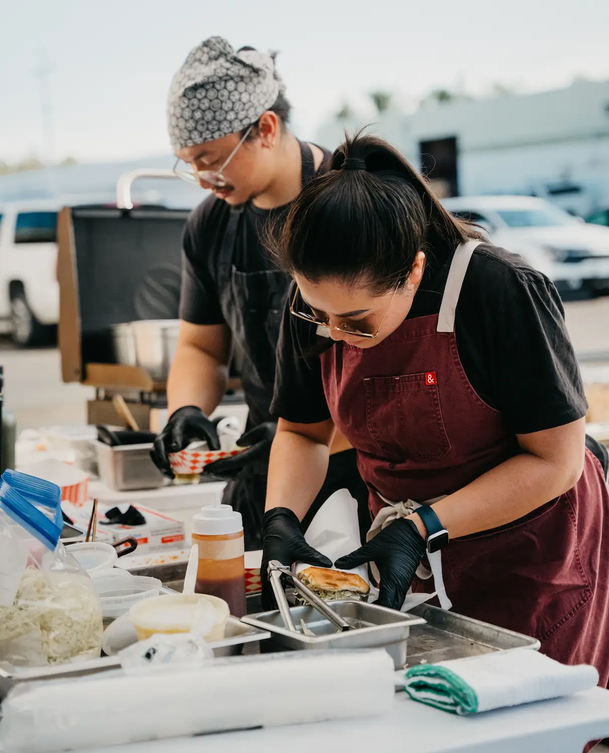 Nathaniel (Nate) Cadsap and Megan Ly working at San Diego pop-up 86'd which will become a new restaurant Common Table in North Park