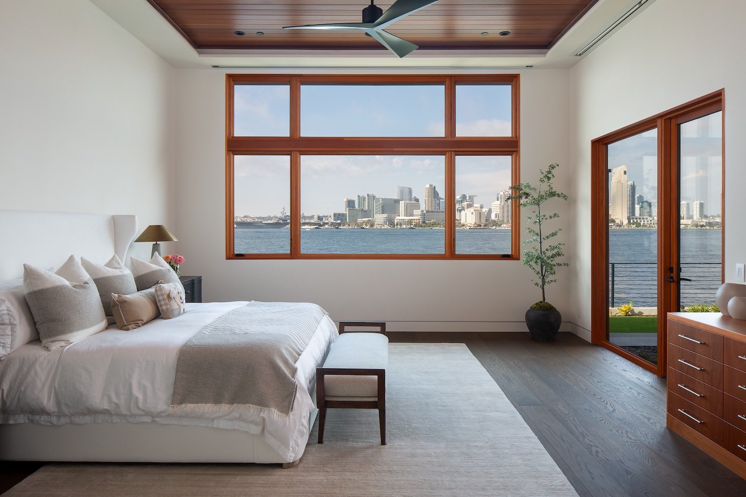 Interior of primary bedroom in a Coronado luxury home with bayfront views renovated by Christian Rice and owned by Allan and Lyndsey Arendsee