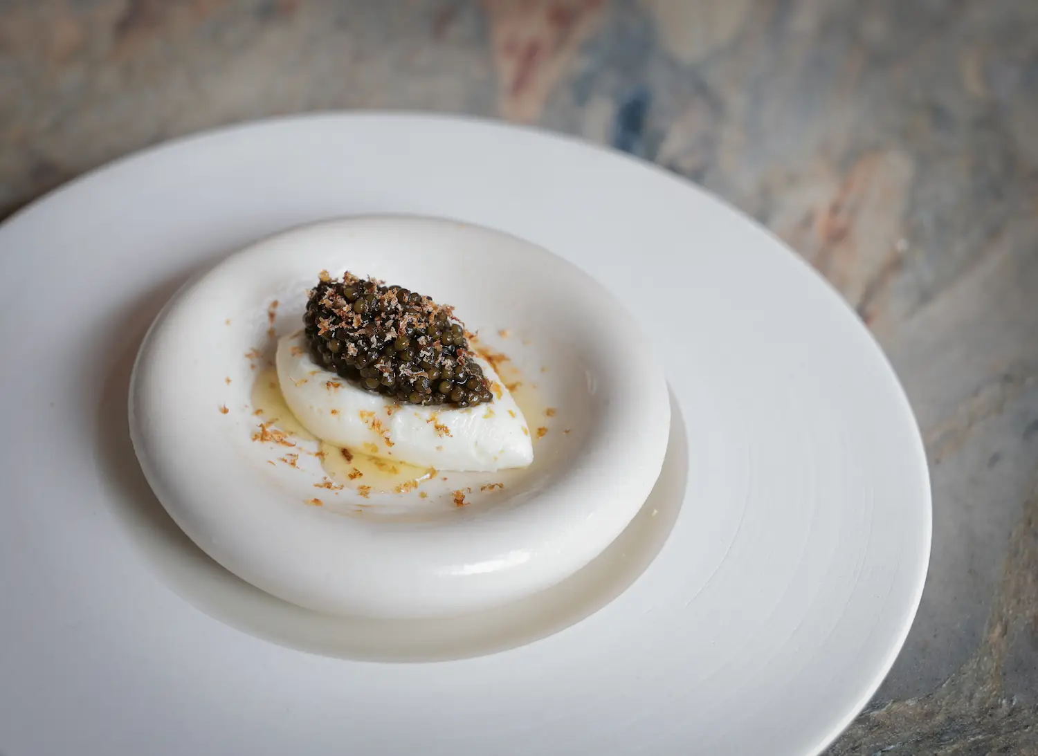 Orgeat ice cream with ossetra caviar from San Diego Michelin star restaurant Lilo in Carlsbad
