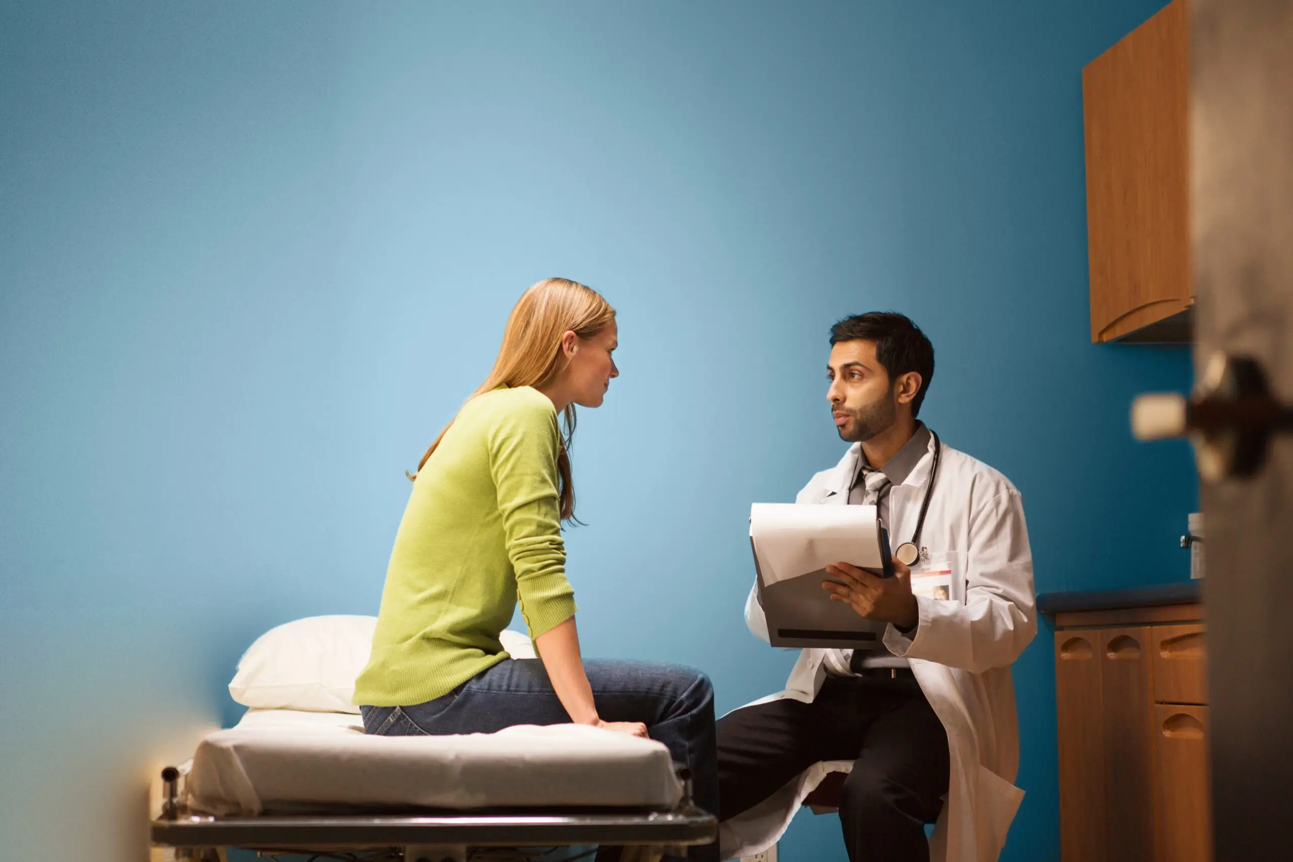Doctor consoling patient