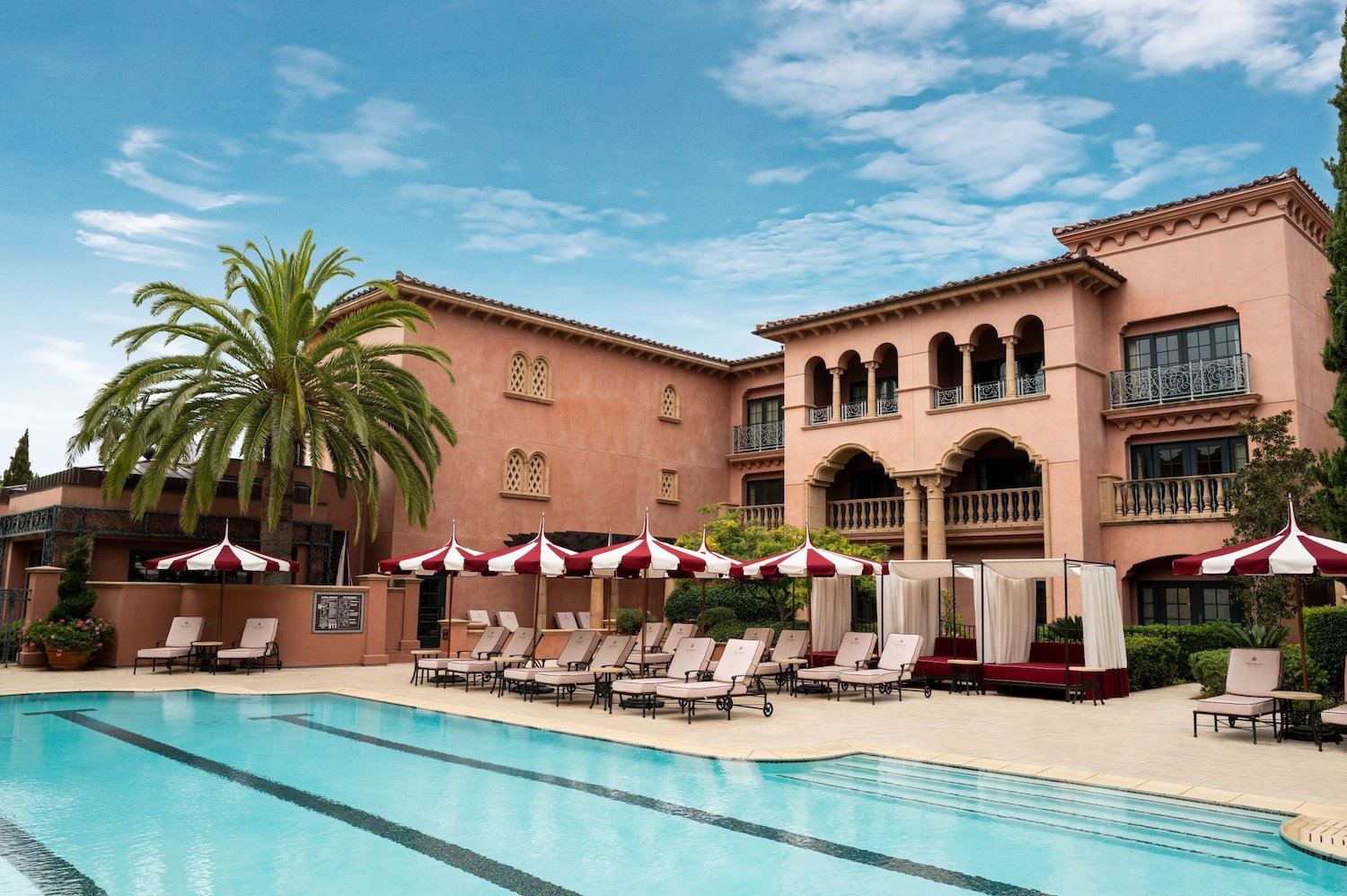 Exterior of San Diego luxury hotel Fairmont Grand Del Mar featuring a pool area