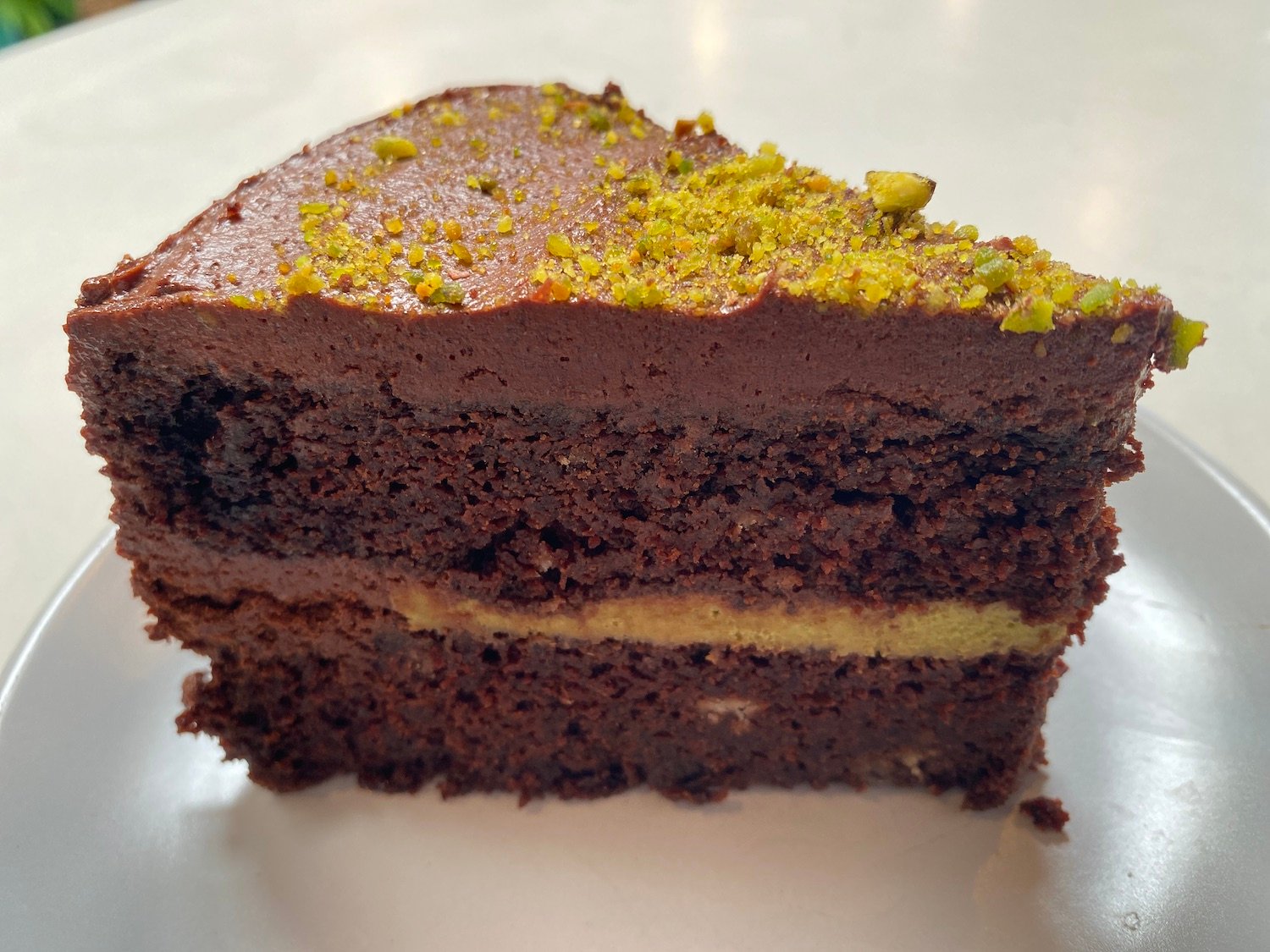 Chocolate Pistachio Cake from Maya Moon Collective in Normal Heights