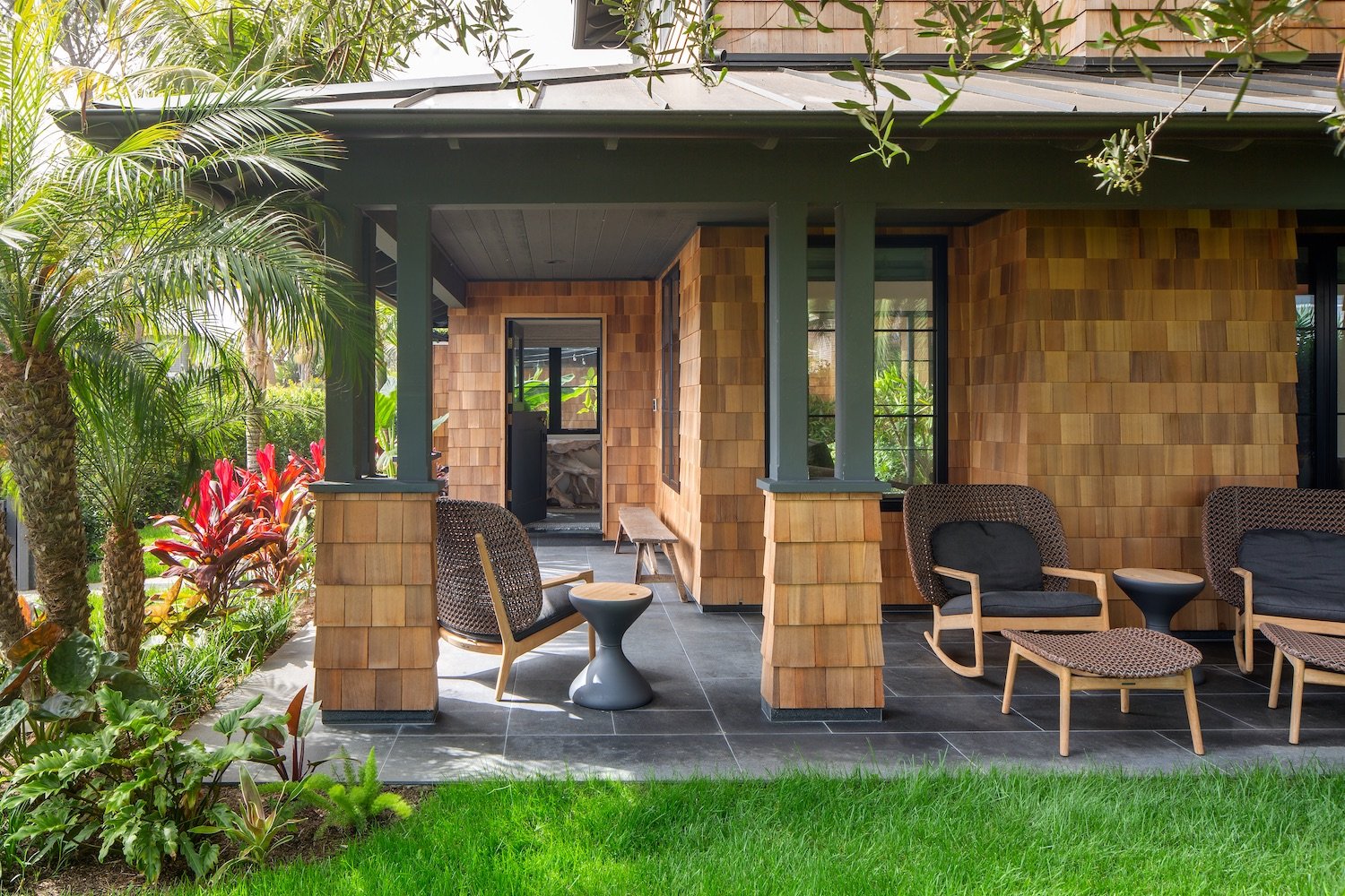 Exterior of Coola Founder's Solana Beach San Diego home featuring an outdoor patio with lounge chairs