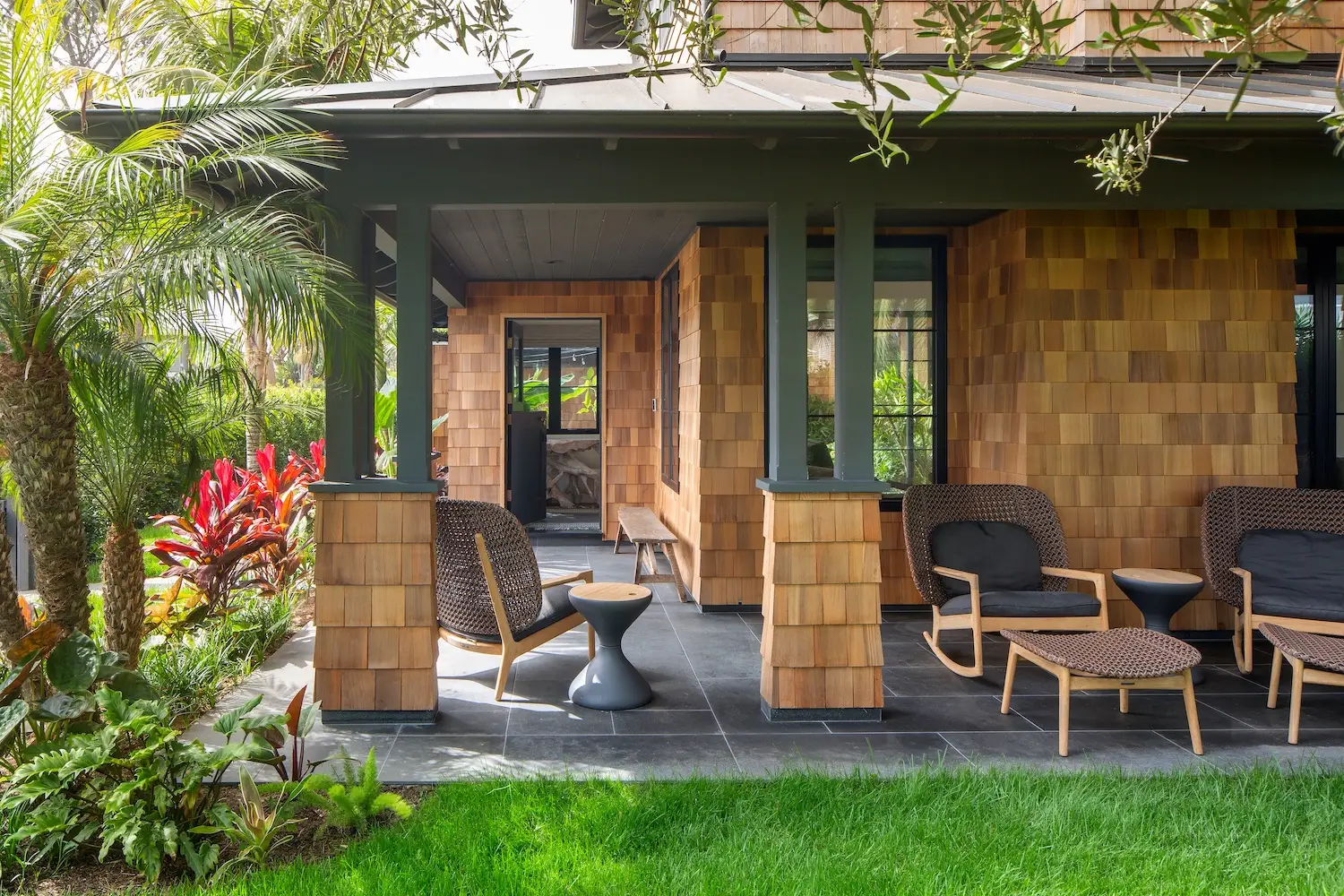 Exterior of Coola Founder's Solana Beach San Diego home featuring an outdoor patio with lounge chairs