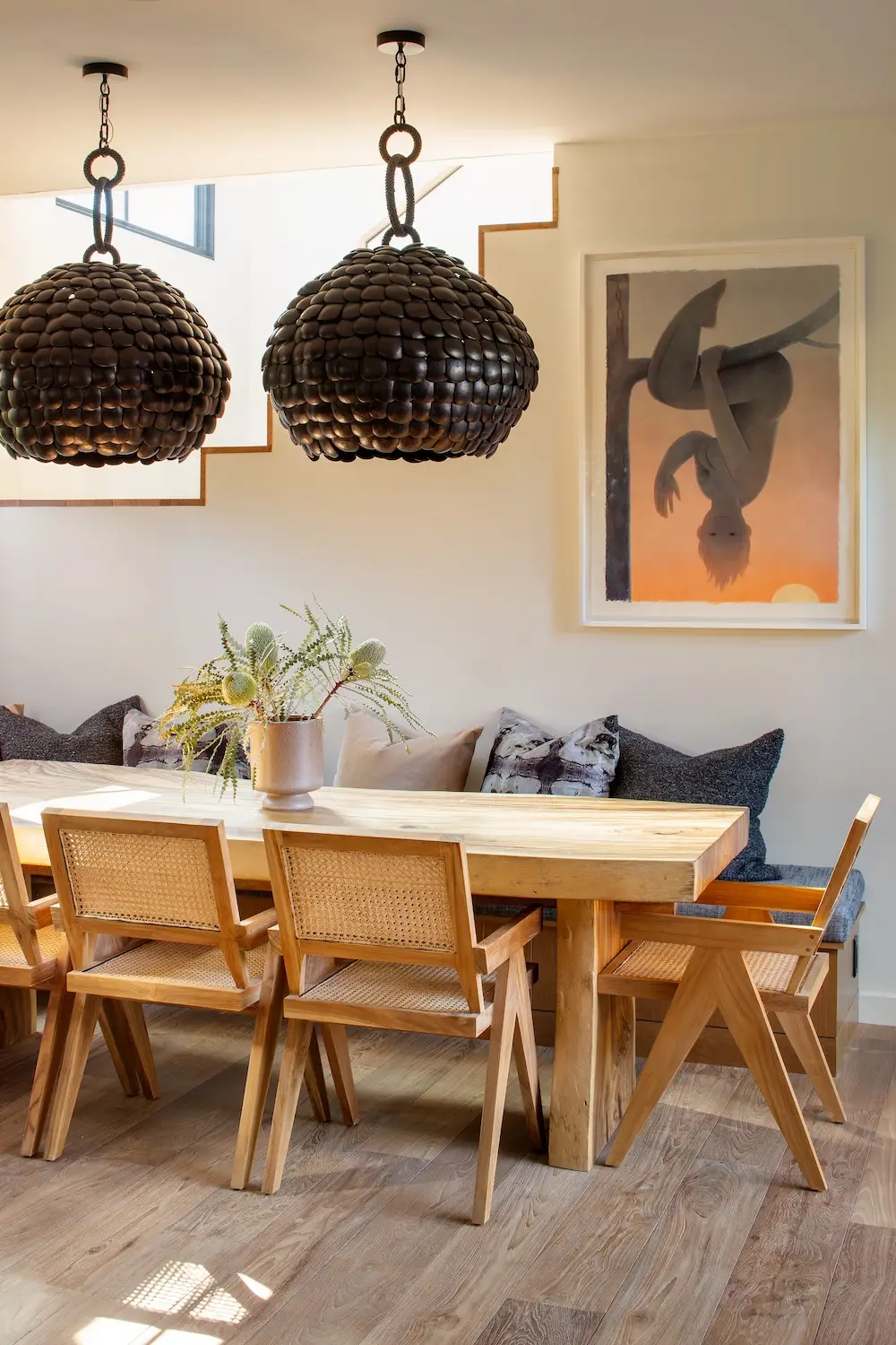 Interior of Coola Founder's Solana Beach San Diego home featuring a dining room with art