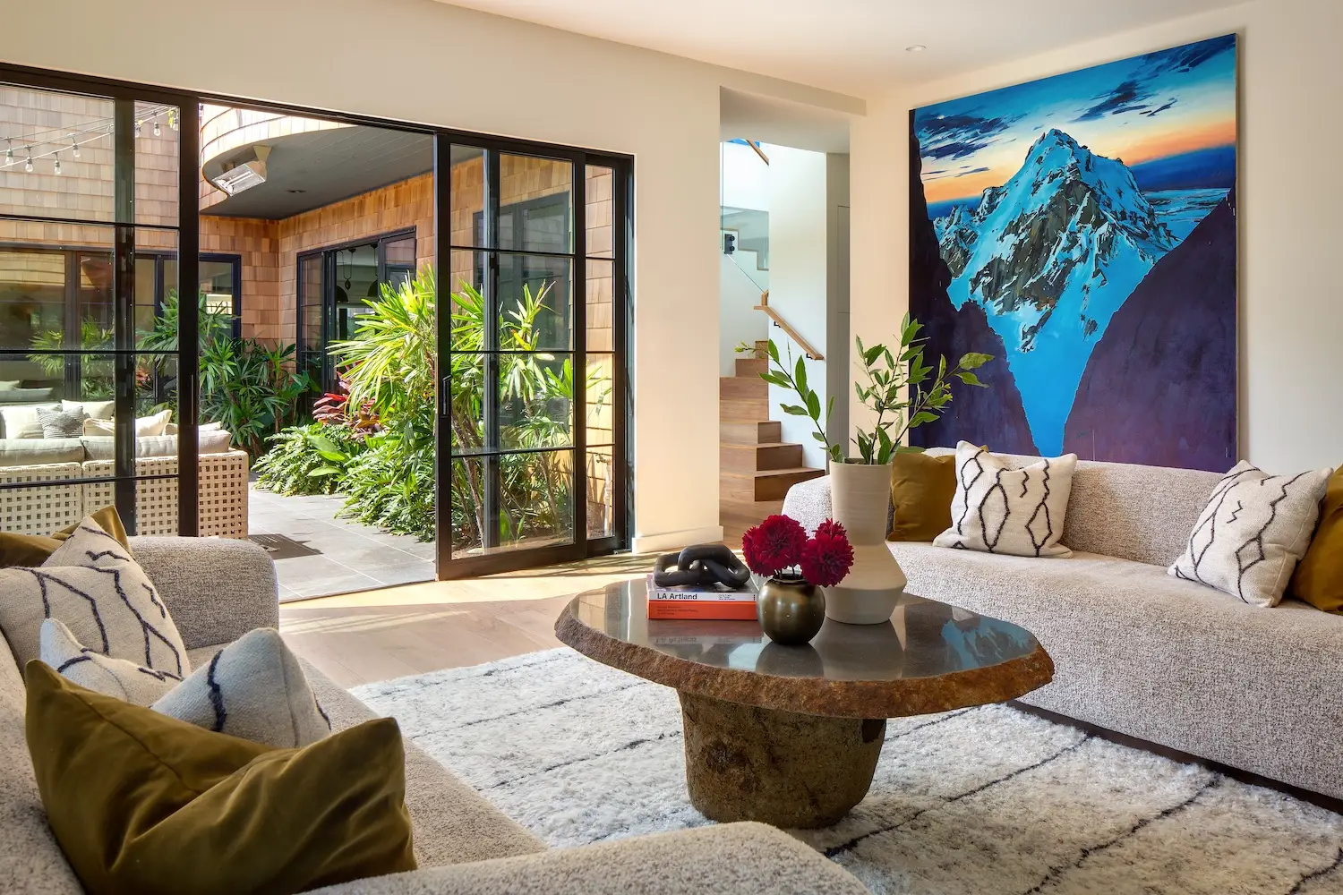 Interior of Coola Founder's Solana Beach San Diego home featuring a living room and modern art
