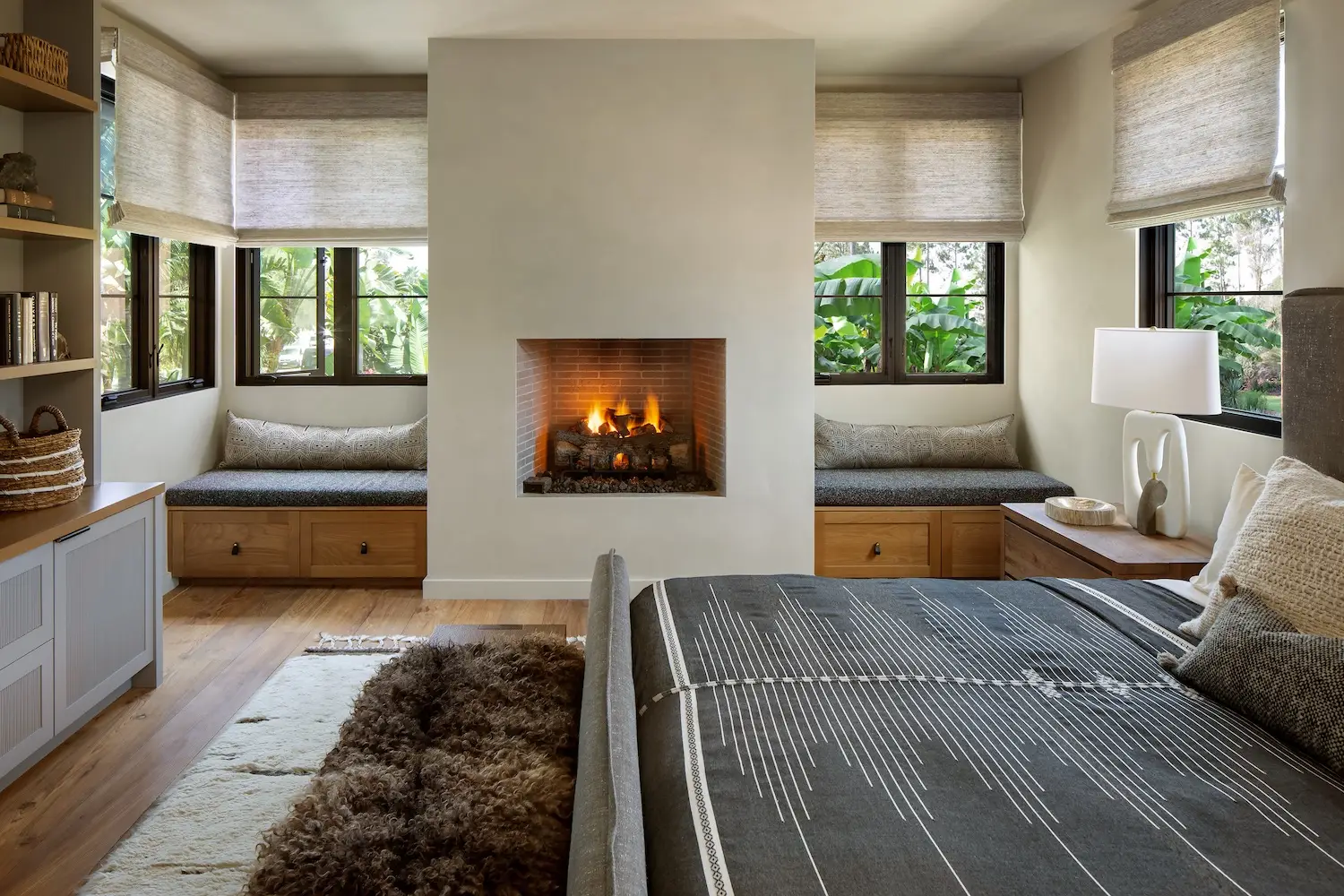 Interior of Coola Founder's Solana Beach San Diego home featuring a primary bedroom with a fireplace