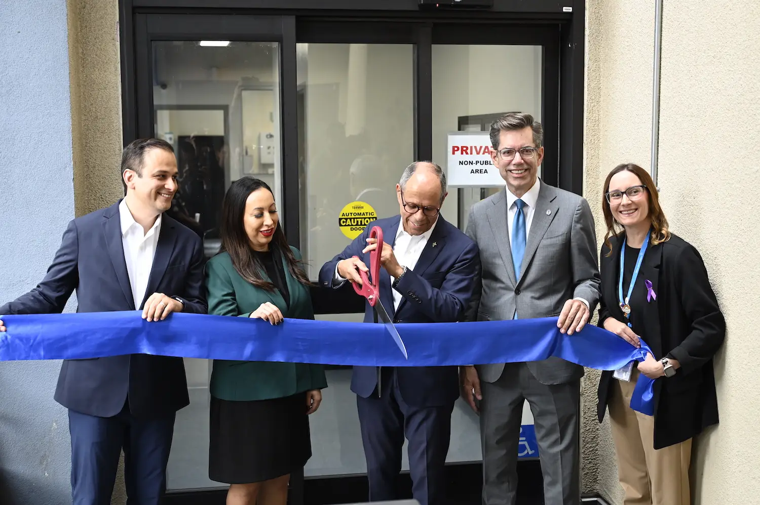 Volunteers and employees of San Diego nonprofit Father Joe's Villages opening ceremony for their new detox facility featuring Deacon Jim Vargas