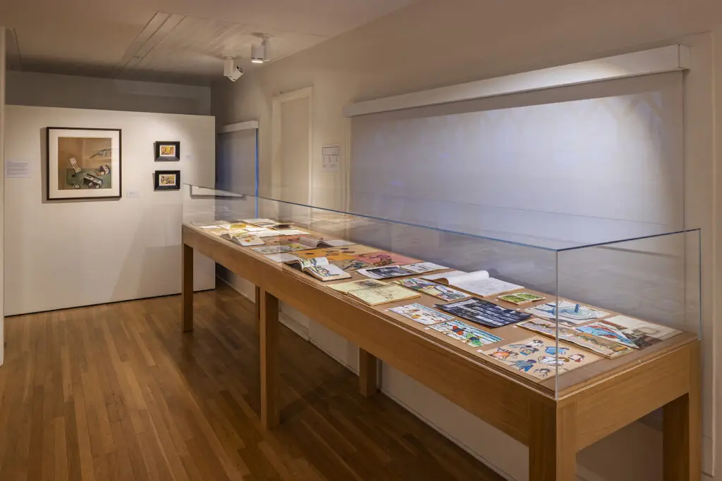 Interior of the La Jolla Historical Society hosting a new art exhibit called Double Bill: The Art of Manny Farber and Patricia Patterson