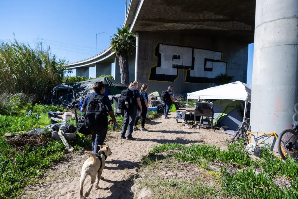 Volunteers and employees of San Diego nonprofit Father Joe's Villages visiting homeless encampments